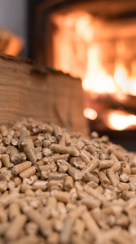 Wood stove heating with in foreground wood pellets - economical heating system concept