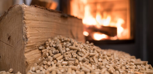 Wood stove heating with in foreground wood pellets - economical heating system concept